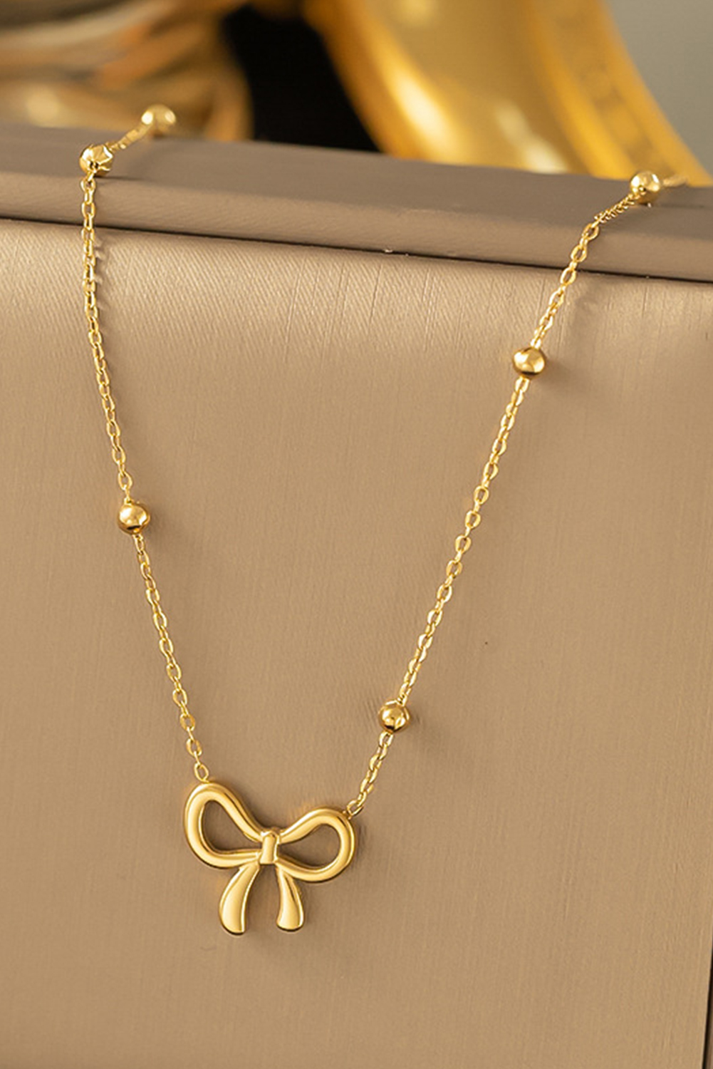 Gold Elegant Bow Design Plated Studded Earrings