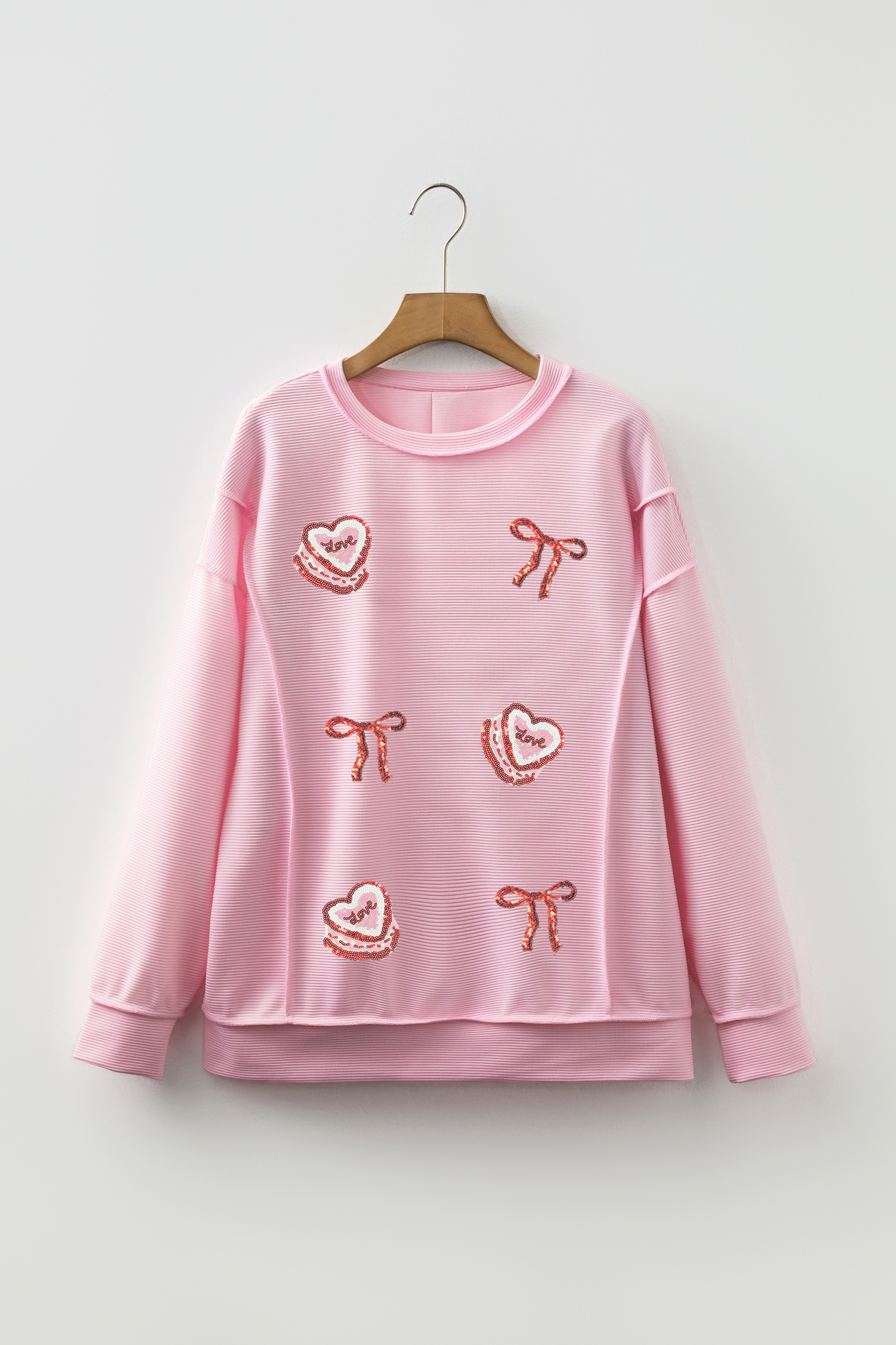 Pink Exposed Seam Ribbed Texture Sequin Love Cake Bow Graphic Long Sleeve Top
