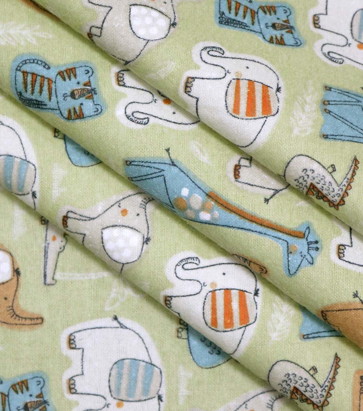 Jungle Animals on Green Super Snuggle Flannel Fabric