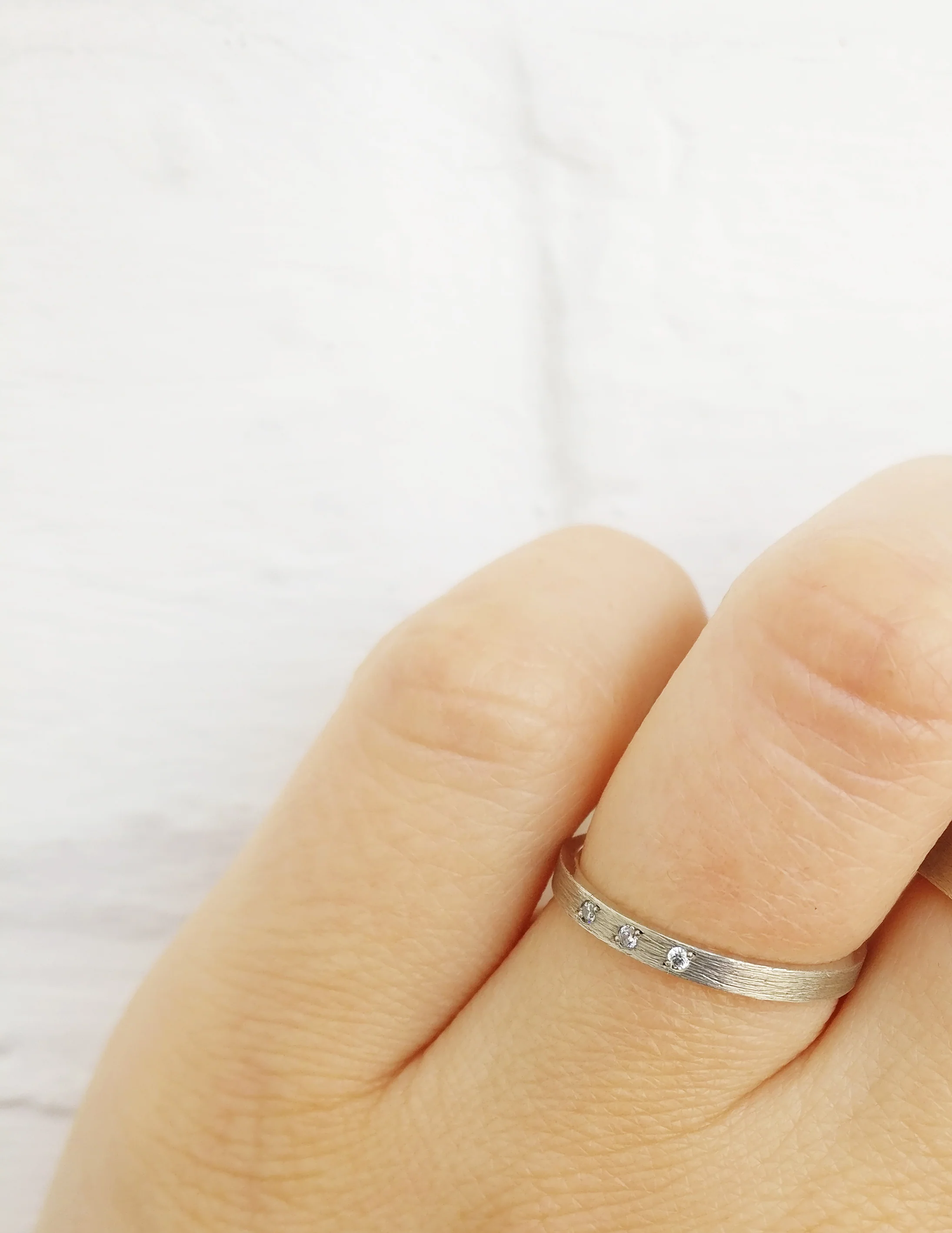 Trouwringen in 18k wit goud met diamant: Serge en Jane