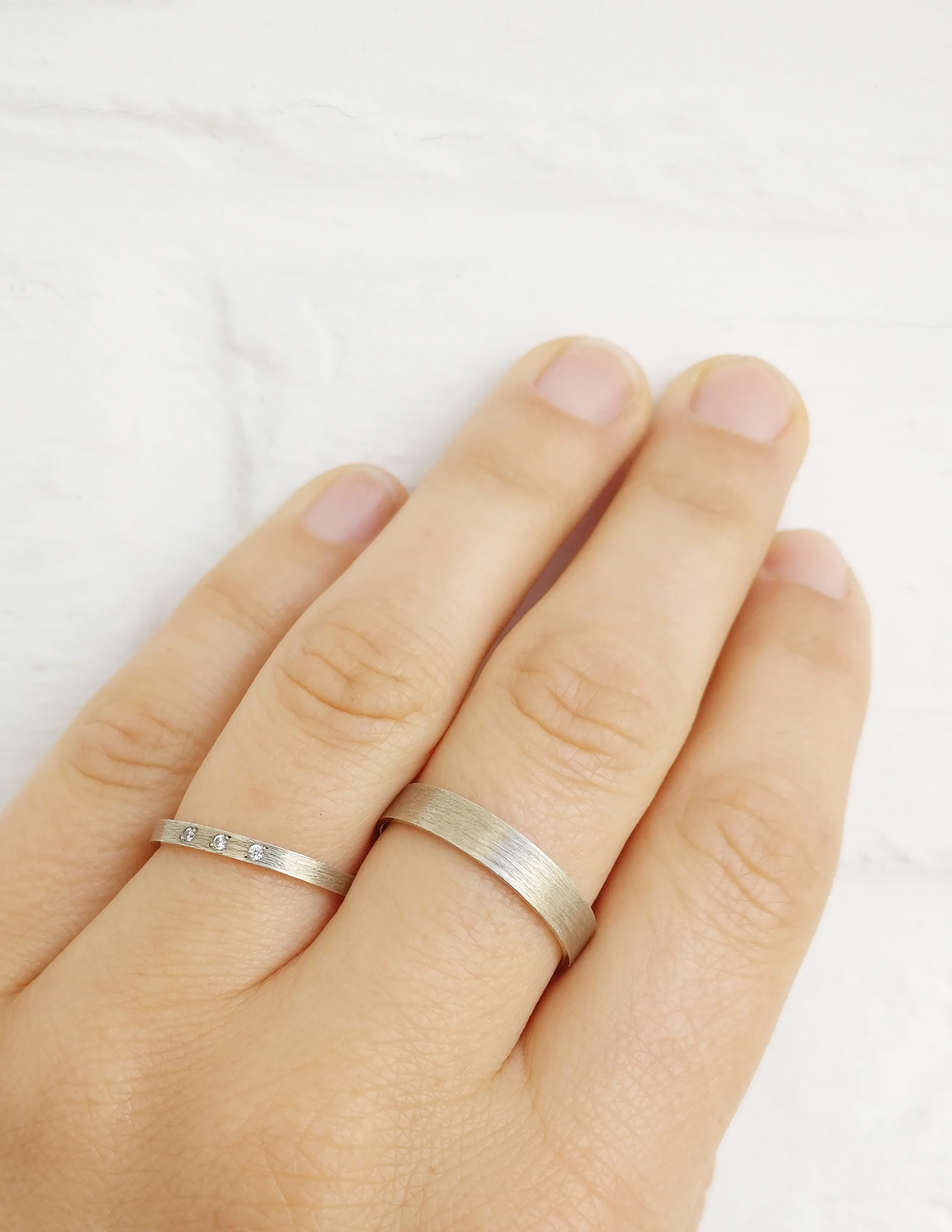 Trouwringen in 18k wit goud met diamant: Serge en Jane