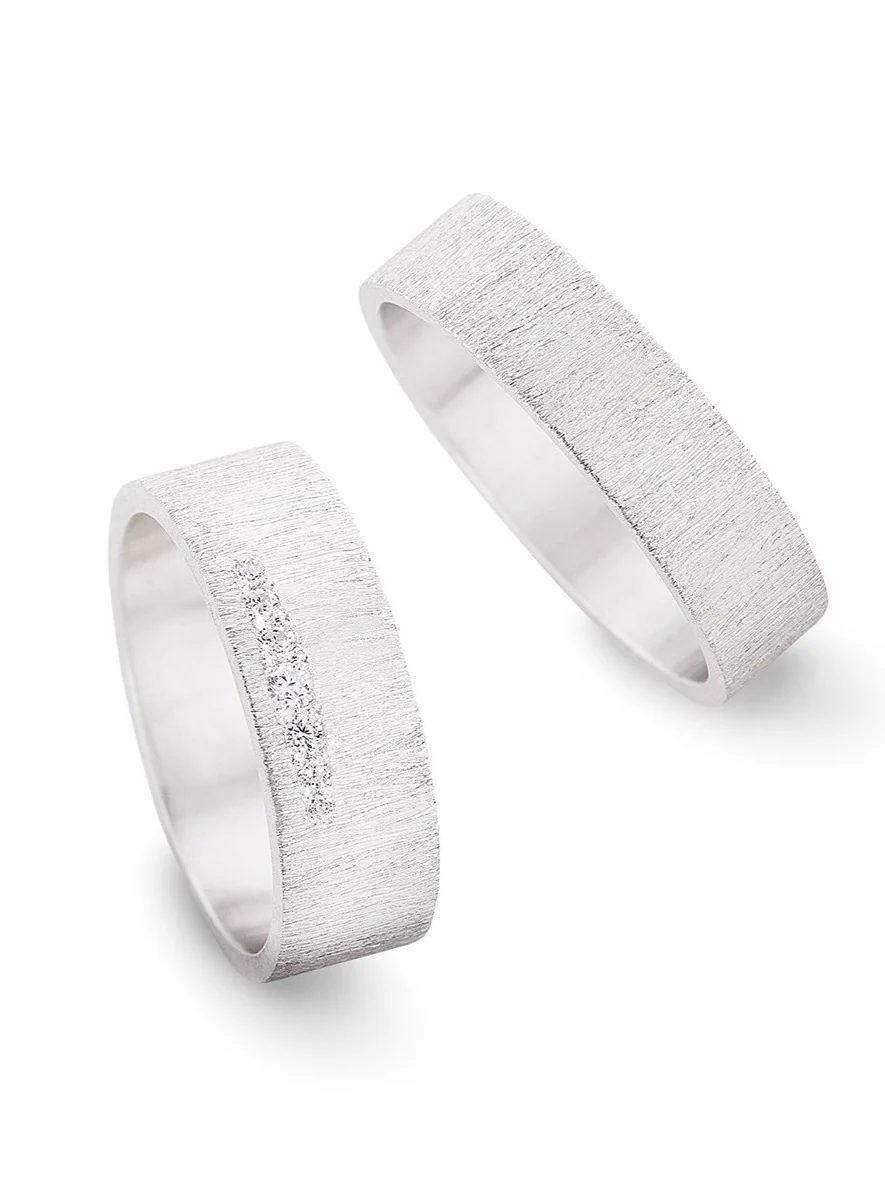 Trouwringen in 18k wit goud met diamant: Jackie en John F