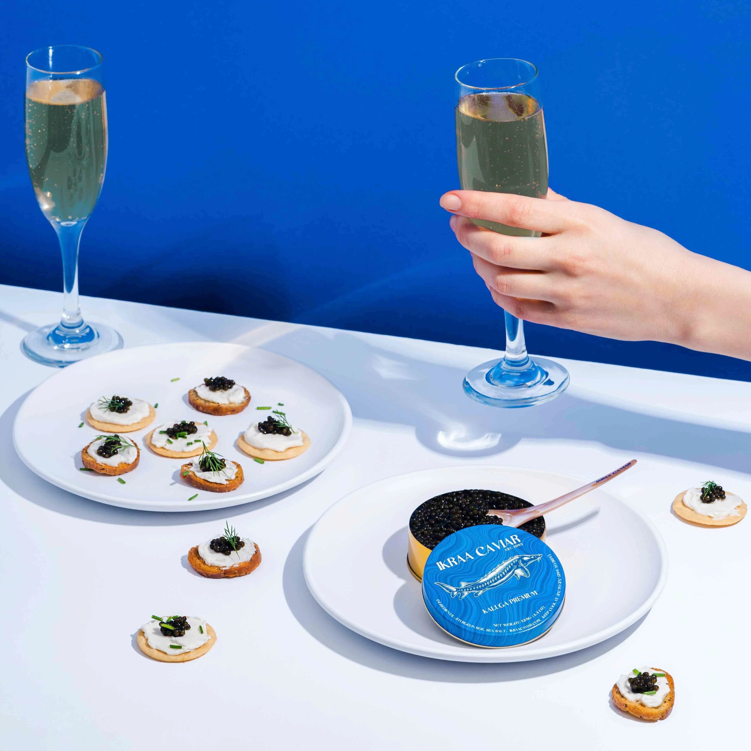 IKRAA Caviar Picnic Pack for Four – 8oz with Blinis, Truffle Butter, Crème Fraîche & Pearl Spoons