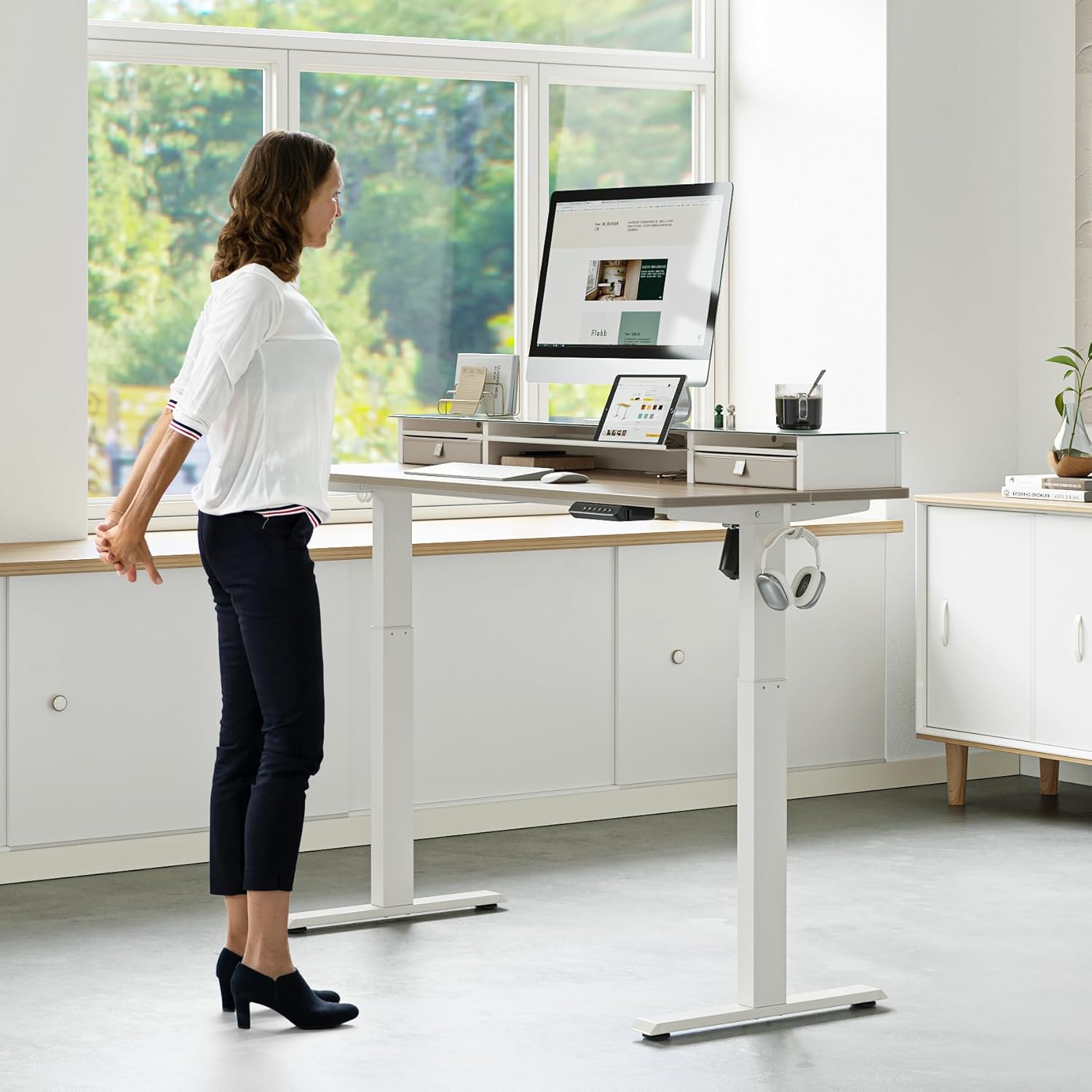 FEZIBO Electric Standing Desk with Double Drawers, 48 x 24 Inch Glass Top Monitor Stand Adjustable Sit Stand Desk with Storage Shelf, White Frame/LightWalnut Top