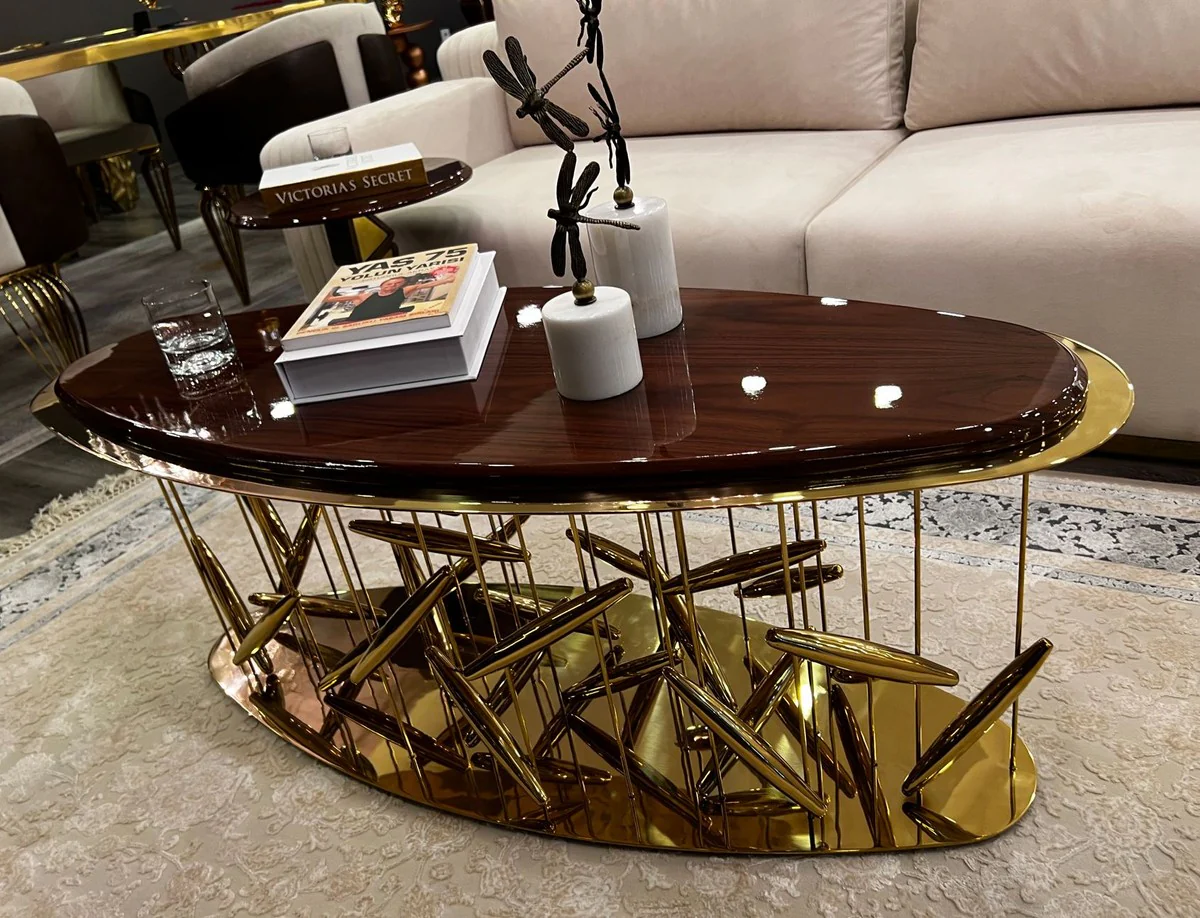 Luxus Couchtisch Braun / Gold 120 x 51 x H. 47 cm - Ovaler Edelstahl Wohnzimmertisch mit Massivholz Tischplatte - Wohnzimmer Möbel - Hotel Möbel - Luxus Möbel