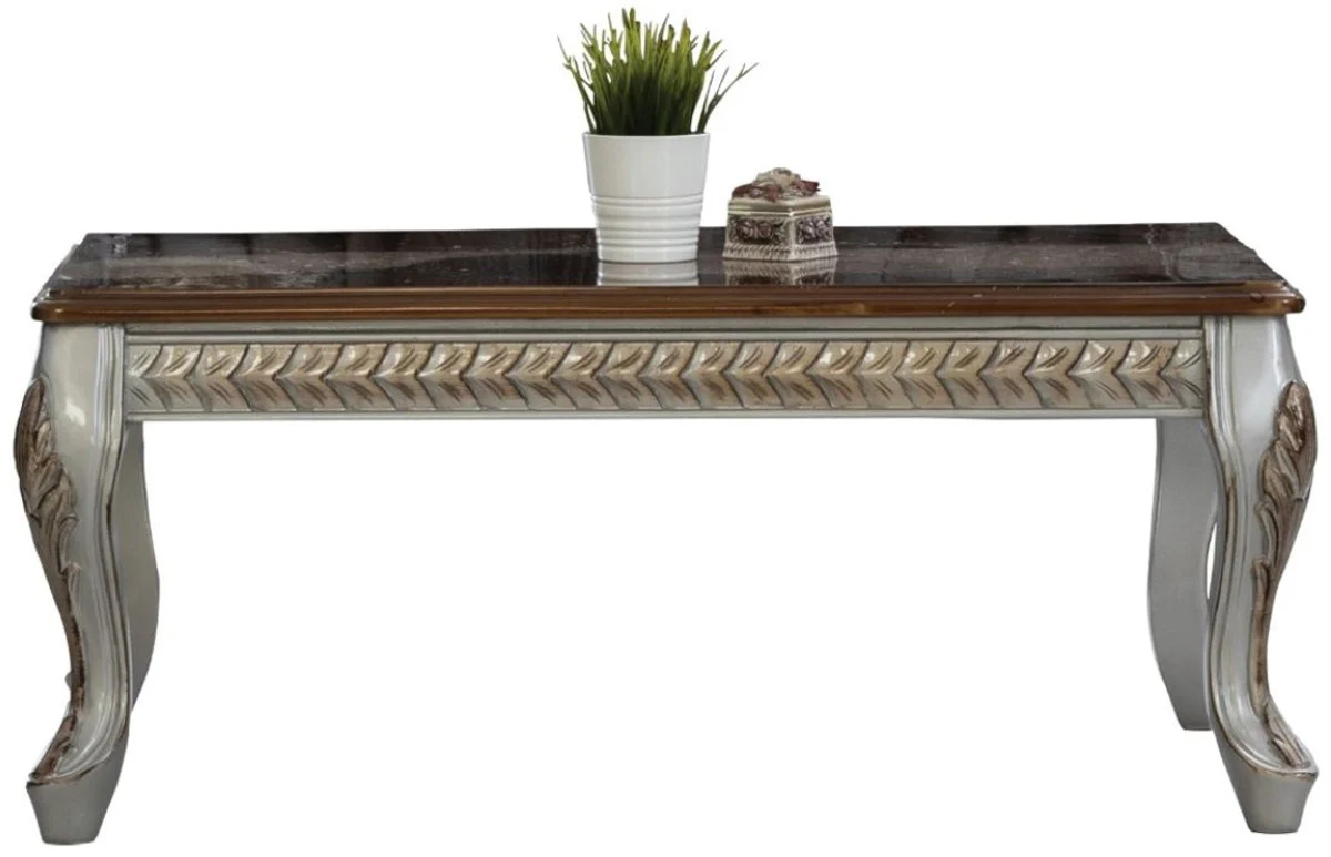 Luxus Barock Couchtisch Braun / Silber / Bronze 115 x 77 x H. 48 cm - Massivholz Wohnzimmertisch - Wohnzimmer Möbel im Barockstil