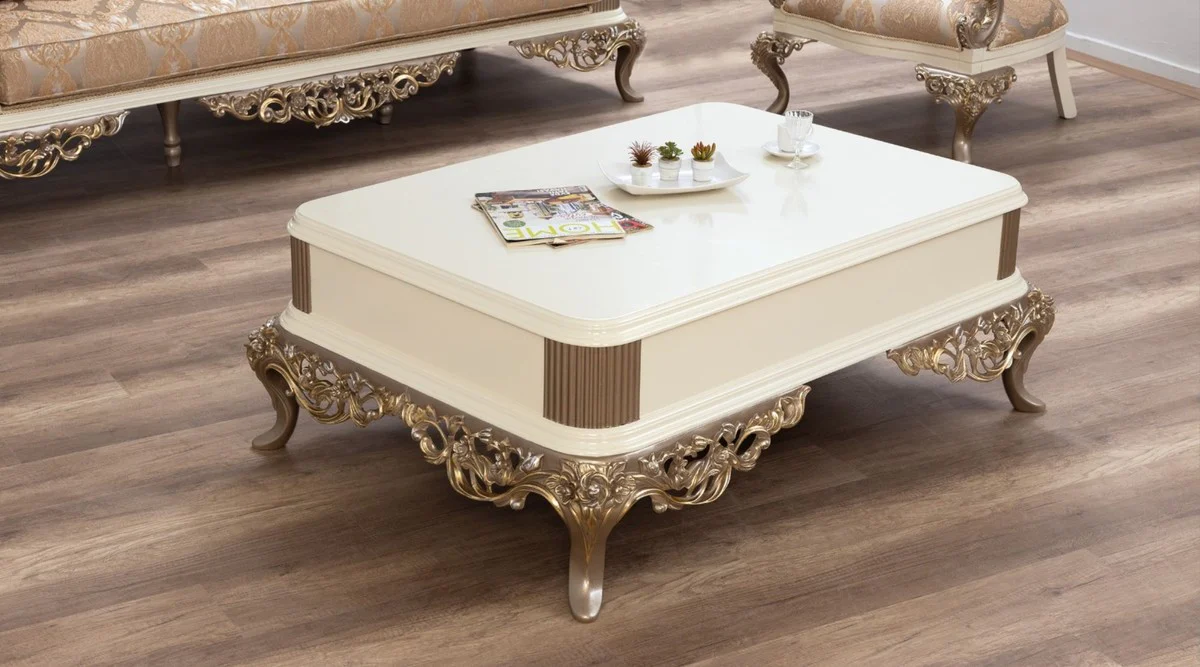 Luxus Barock Couchtisch Weiß / Braun / Gold 130 x 92 x H. 50 cm - Prunkvoller handgefertigter Wohnzimmertisch im Barockstil - Barock Möbel