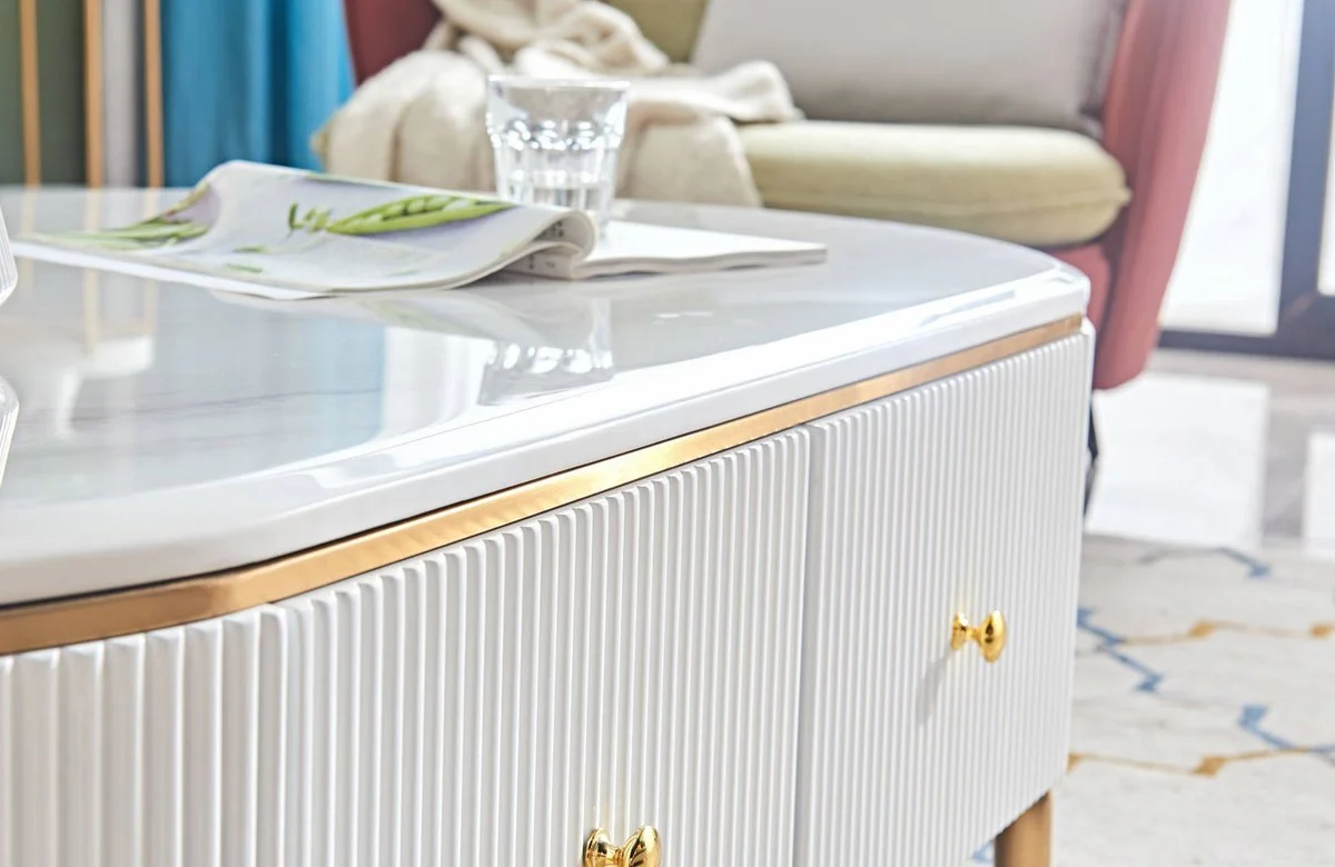 Luxus Couchtisch Weiß / Messingfarben / Gold 130 x 70 x H. 42 cm - Moderner Wohnzimmertisch mit 4 Schubladen - Moderne Wohnzimmer Möbel