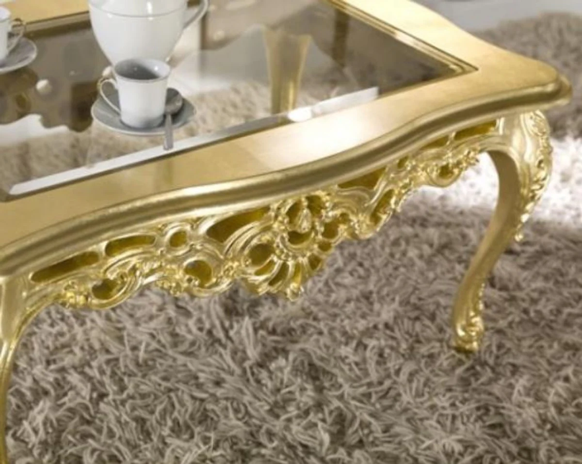 Luxus Barock Couchtisch Gold 84 x 44 x H. 57 cm - Prunkvoller Wohnzimmertisch mit Glasplatte - Barock Wohnzimmer Möbel - Luxus Qualität - Made in Italy