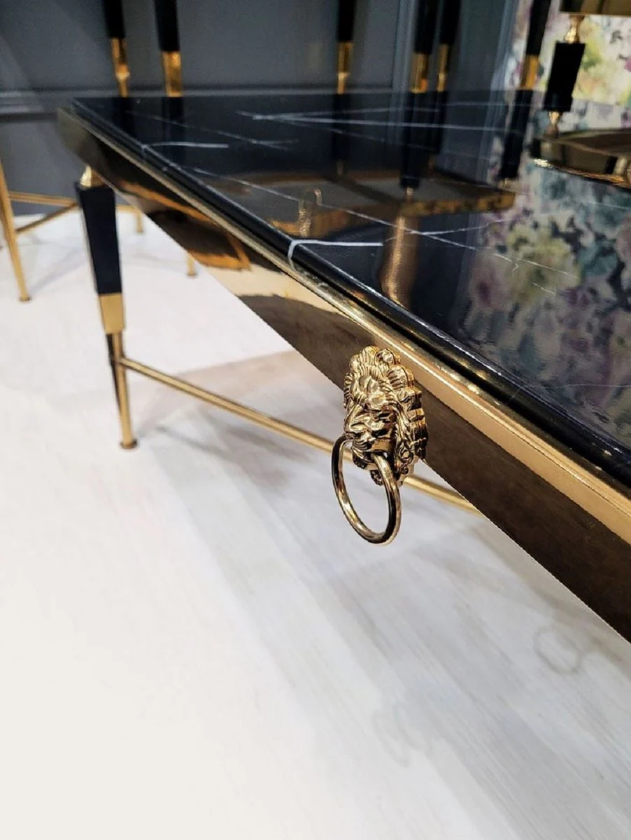Luxus Couchtisch Schwarz / Gold 130 x 70 x H. 45 cm - Wohnzimmertisch mit Kunstmarmor Tischplatte - Luxus Wohnzimmer Möbel - Hotel Möbel - Luxus Einrichtung - Hotel Einrichtung