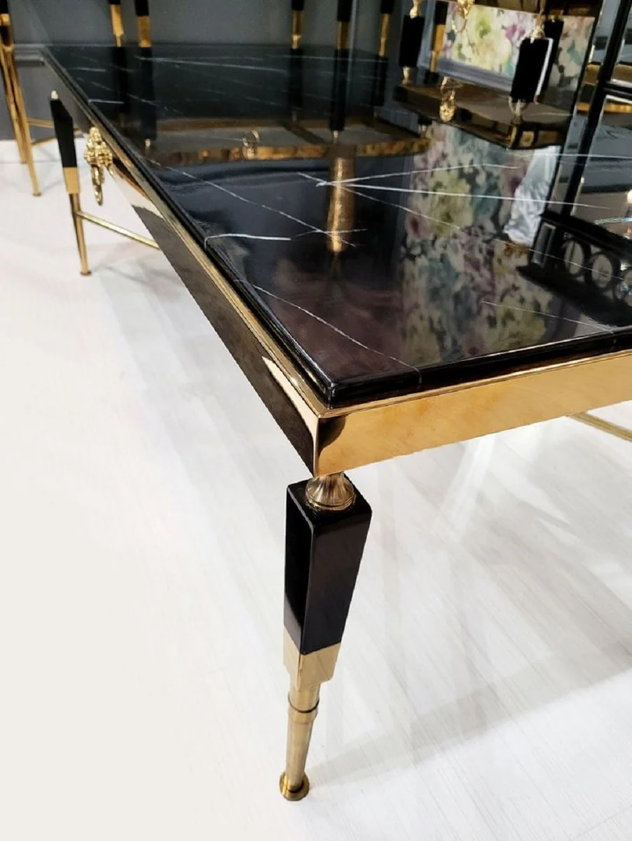 Luxus Couchtisch Schwarz / Gold 130 x 70 x H. 45 cm - Wohnzimmertisch mit Kunstmarmor Tischplatte - Luxus Wohnzimmer Möbel - Hotel Möbel - Luxus Einrichtung - Hotel Einrichtung