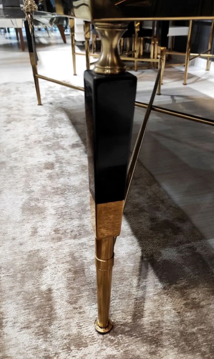 Luxus Couchtisch Schwarz / Gold 130 x 70 x H. 45 cm - Wohnzimmertisch mit Kunstmarmor Tischplatte - Luxus Wohnzimmer Möbel - Hotel Möbel - Luxus Einrichtung - Hotel Einrichtung