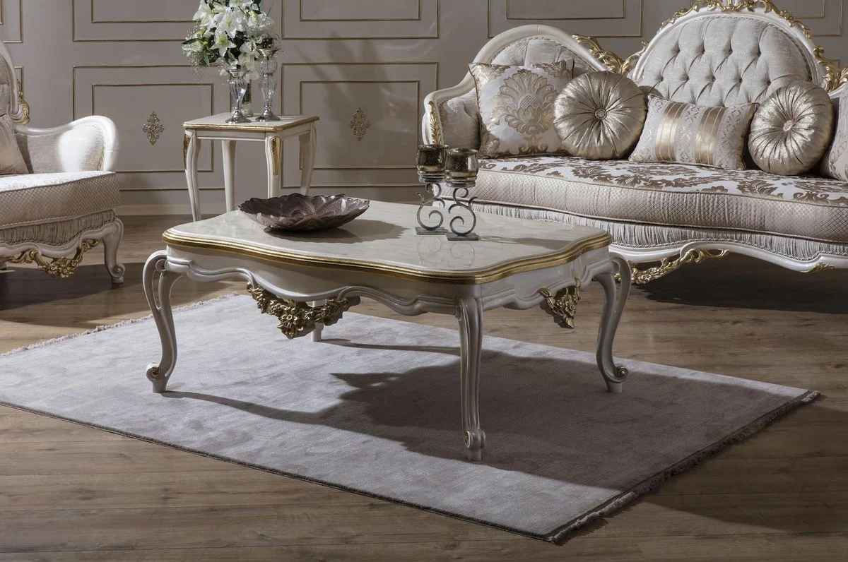 Luxus Barock Couchtisch Weiß / Gold 130 x 90 x H. 47 cm - Prunkvoller Massivholz Wohnzimmertisch im Barockstil - Barock Möbel