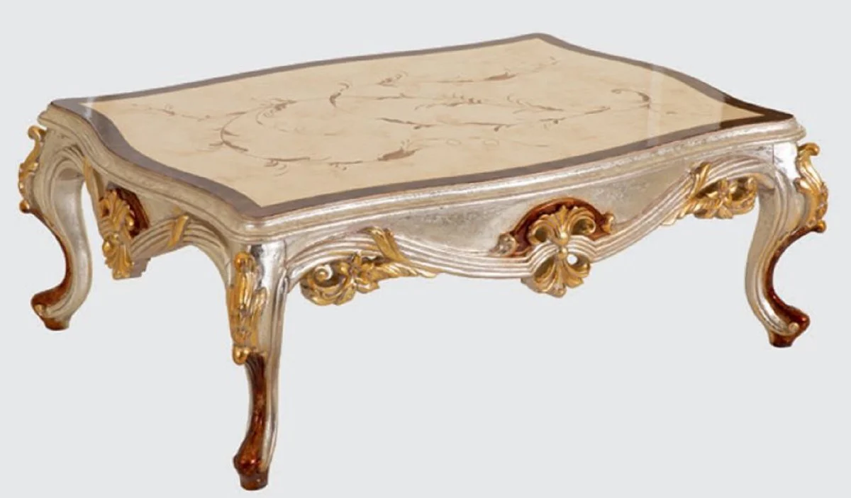 Luxus Barock Couchtisch Creme / Silber / Braun / Gold 125 x 90 x H. 45 cm - Handgefertigter Massivholz Wohnzimmertisch im Barockstil - Barock Möbel