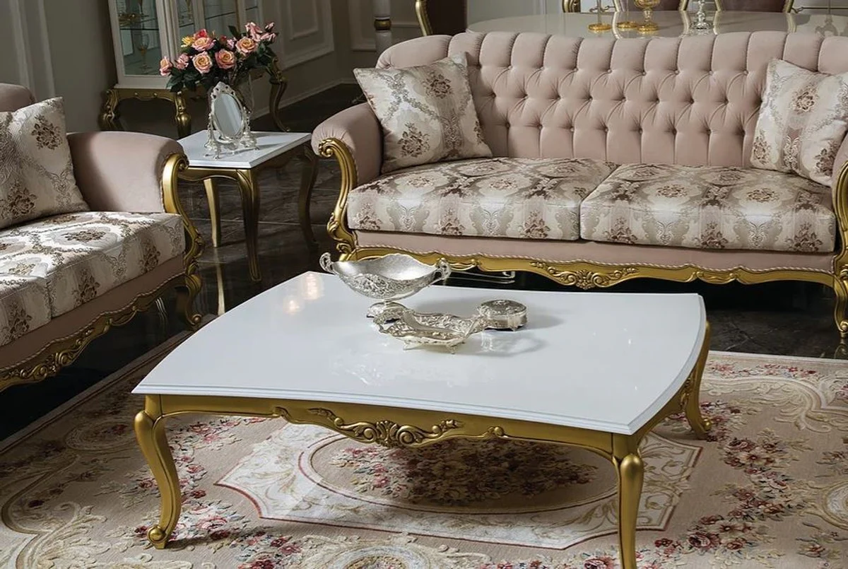 Luxus Barock Couchtisch Weiß / Gold 137 x 90 x H. 46 cm - Prunkvoller Massivholz Wohnzimmertisch im Barockstil - Barock Möbel